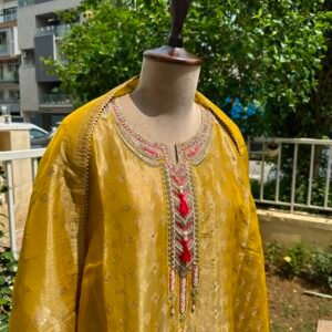 Muted Mustard Gold unstitched shimmer organza suit with embroidered neck line paired with Banarsi dupatta